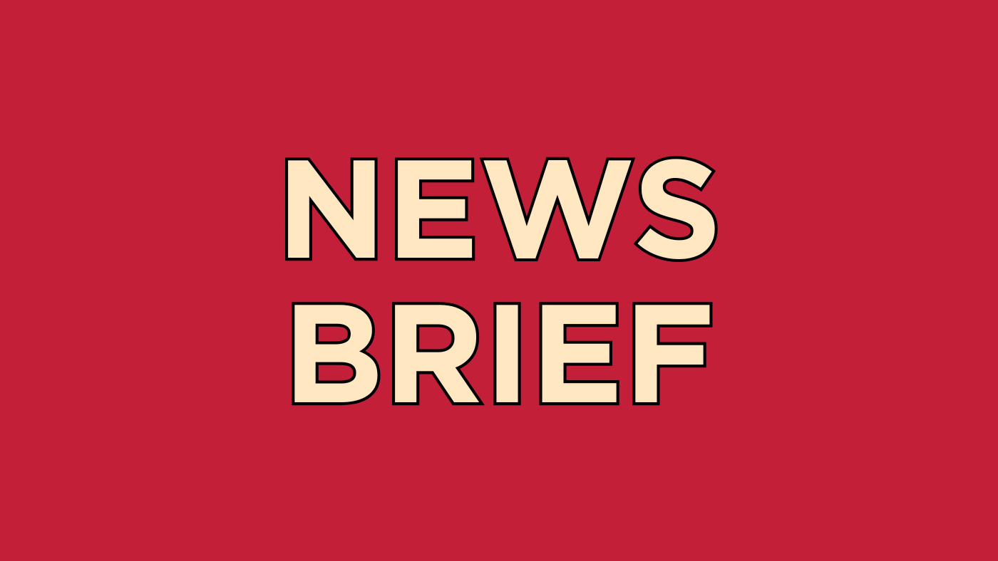 Yellow text on a red background: NEWS BRIEF.